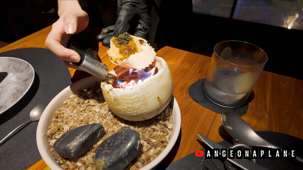 A crab shell being torched at Tre Dining